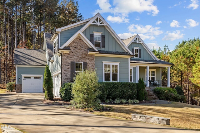 181 Colonial Ridge Dr, Pittsboro, NC 27312 - view of front of home featuring board and batten siding, driveway, a porch, stairway, and an attached garage