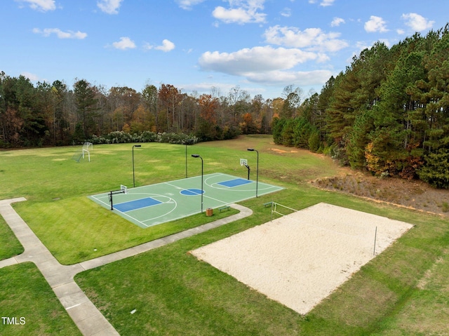 view of basketball court featuring a yard