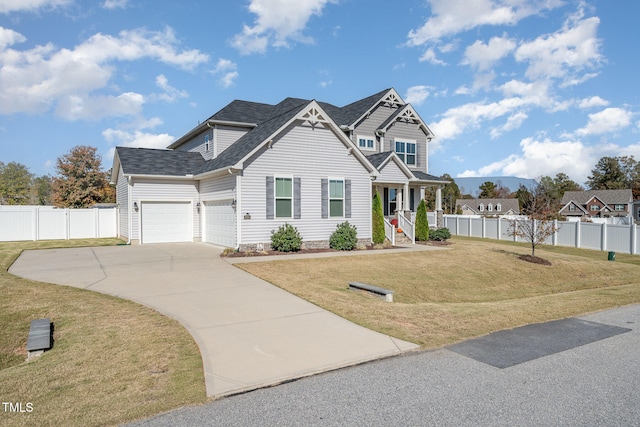 view of front of property with a garage and a front lawn