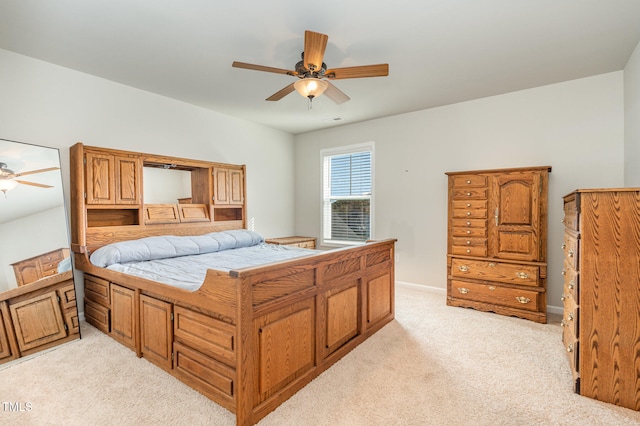 bedroom with light colored carpet and ceiling fan