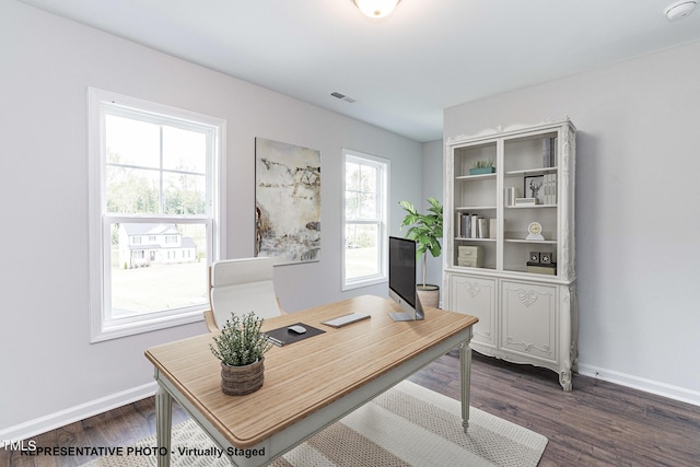 office with dark hardwood / wood-style flooring