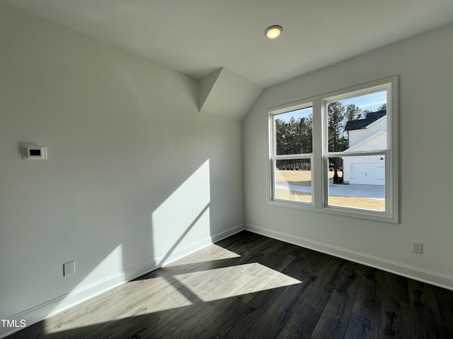 bonus room with dark wood-type flooring