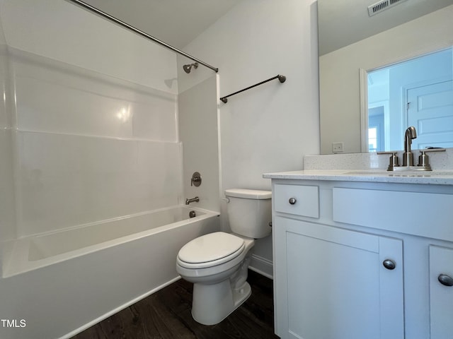 full bathroom with vanity, toilet, tub / shower combination, and hardwood / wood-style floors