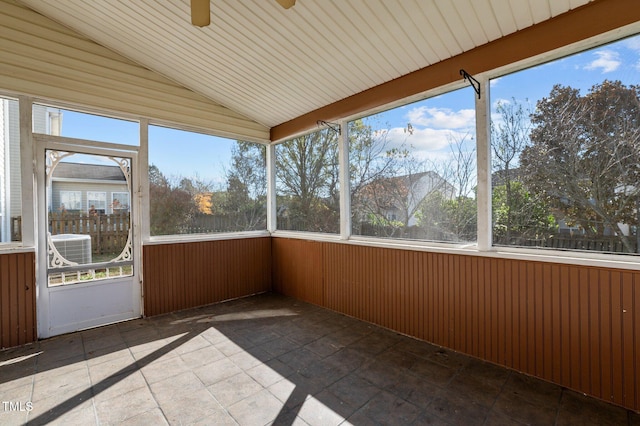 unfurnished sunroom featuring ceiling fan and vaulted ceiling