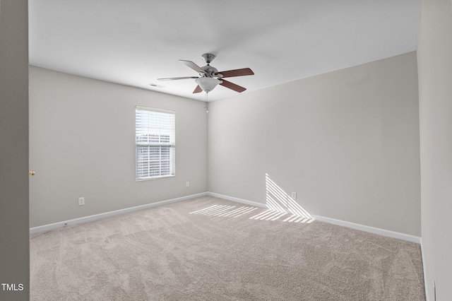 carpeted empty room with ceiling fan