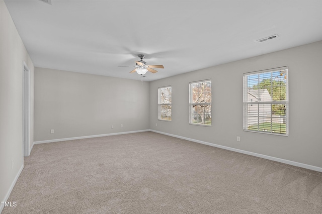 carpeted empty room with ceiling fan