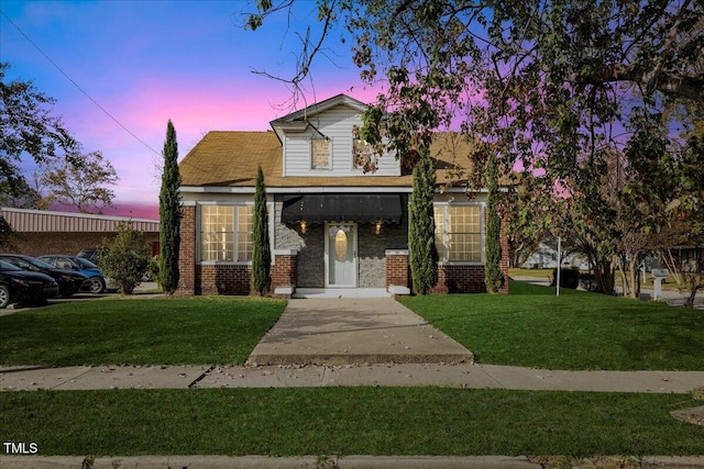 view of front of home with a yard