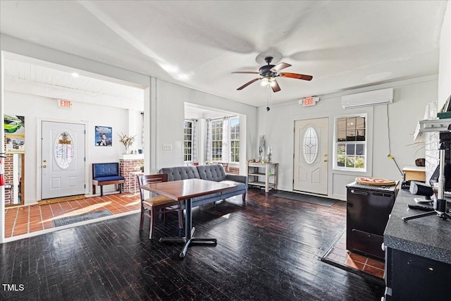 interior space with a wall unit AC, beamed ceiling, ceiling fan, and dark hardwood / wood-style flooring