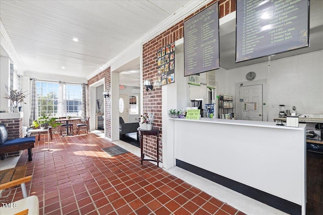 kitchen with brick wall and crown molding