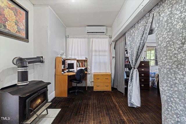 office with dark hardwood / wood-style floors, crown molding, and a wall mounted air conditioner