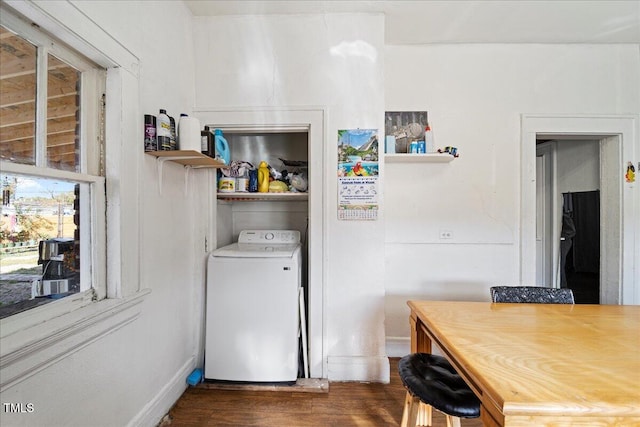 laundry room featuring dark hardwood / wood-style flooring and washer / clothes dryer