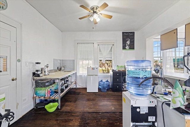 interior space featuring ceiling fan, sink, white fridge, and dark hardwood / wood-style floors