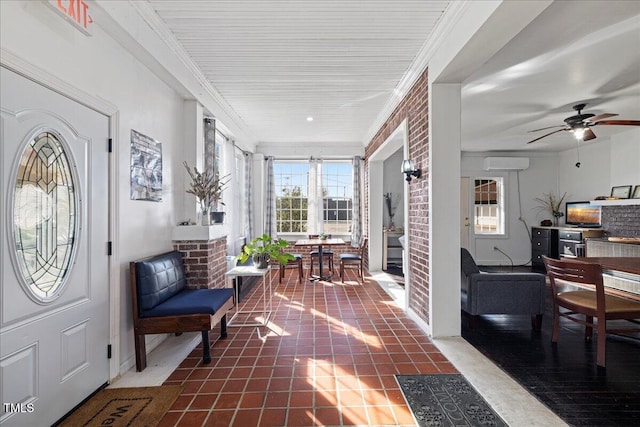 interior space with an AC wall unit, ceiling fan, and dark tile patterned floors