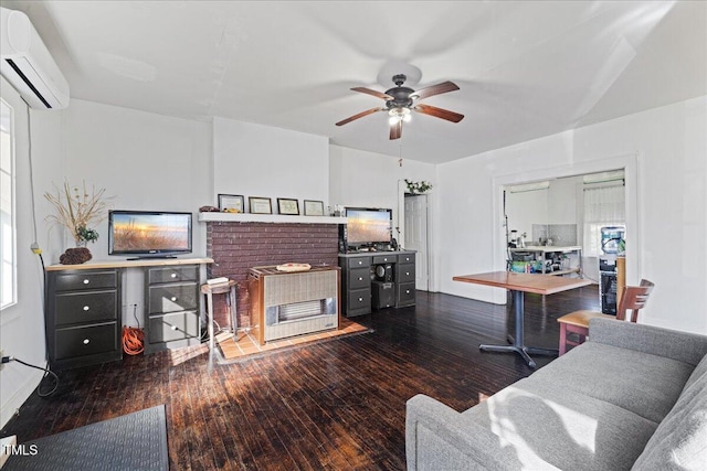 living room with ceiling fan, dark hardwood / wood-style floors, and a wall mounted AC