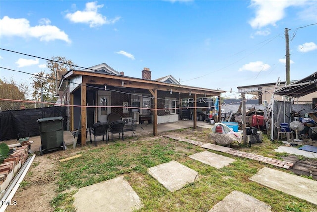 back of house featuring a patio area