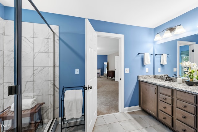 bathroom featuring vanity, an enclosed shower, and tile patterned flooring