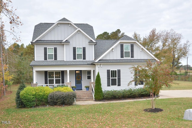 craftsman-style house with a porch and a front yard