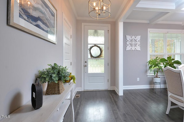 foyer entrance with crown molding, dark hardwood / wood-style floors, coffered ceiling, an inviting chandelier, and beamed ceiling