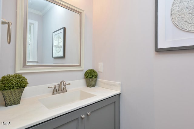 bathroom featuring vanity and crown molding