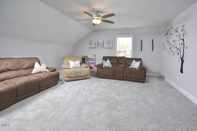 living room with carpet floors, ceiling fan, and vaulted ceiling