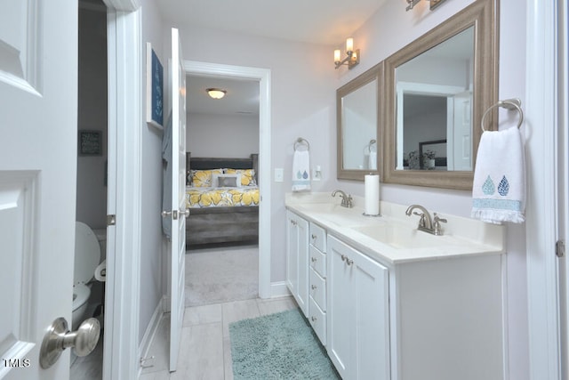 bathroom with vanity and tile patterned flooring