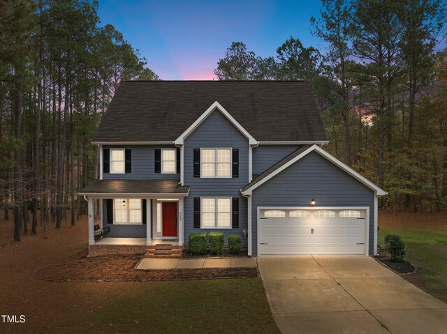 5600 Thornburg Dr, Wake Forest, NC 27587 - view of front facade with concrete driveway and an attached garage