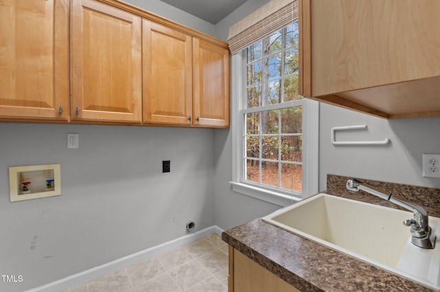 5600 Thornburg Dr, Wake Forest, NC 27587 - laundry room with cabinet space, washer hookup, baseboards, electric dryer hookup, and light tile patterned floors