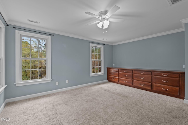 unfurnished bedroom featuring ceiling fan, light colored carpet, and ornamental molding