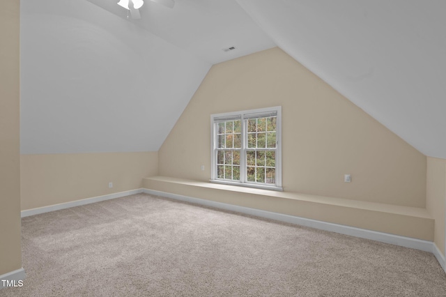 bonus room featuring carpet flooring, vaulted ceiling, and ceiling fan