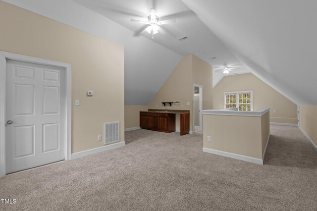 5600 Thornburg Dr, Wake Forest, NC 27587 - bonus room with a ceiling fan, light colored carpet, lofted ceiling, and baseboards