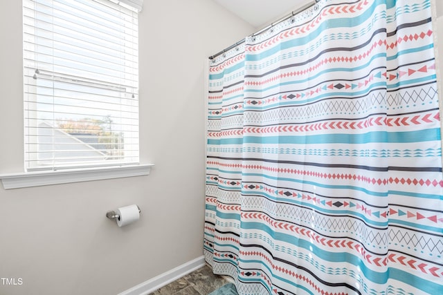 bathroom with curtained shower