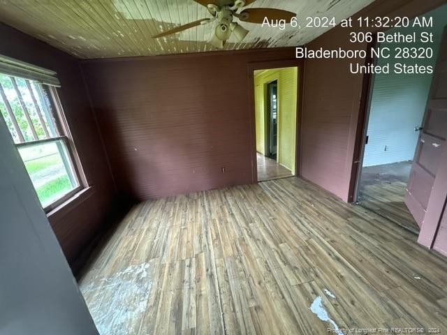 unfurnished room featuring hardwood / wood-style floors and ceiling fan