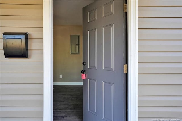 property entrance featuring electric panel