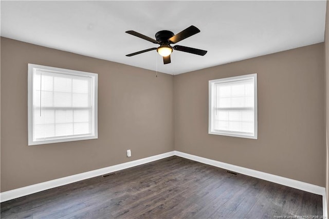 unfurnished room featuring dark hardwood / wood-style flooring and ceiling fan