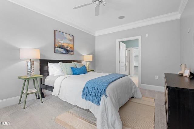 bedroom with ensuite bathroom, ceiling fan, light carpet, and crown molding