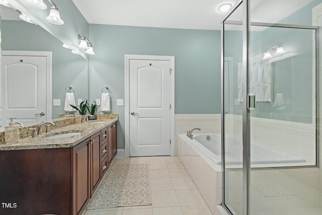 bathroom with separate shower and tub, vanity, and tile patterned floors