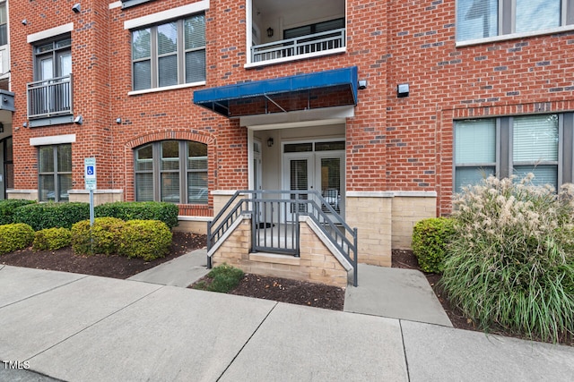 doorway to property featuring a balcony