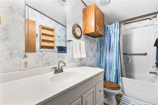 full bathroom featuring shower / tub combo with curtain, vanity, a textured ceiling, and toilet