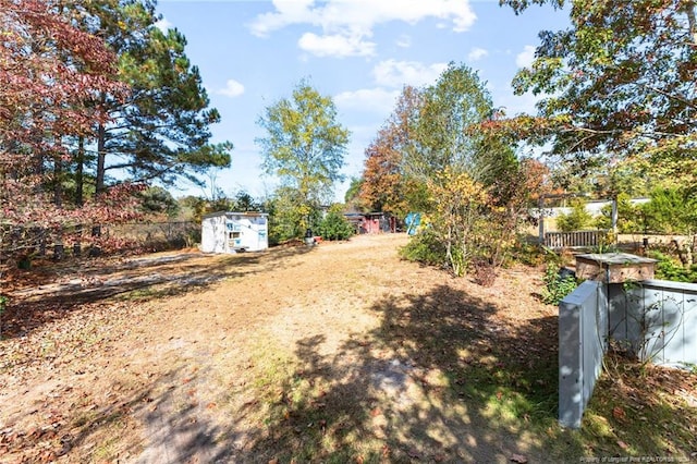 view of yard with a storage unit