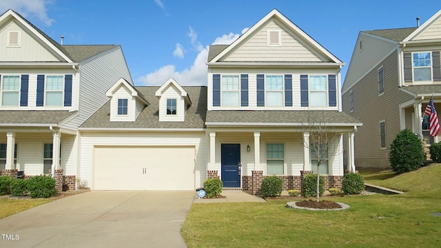 view of front of home featuring a garage, a porch, and a front yard