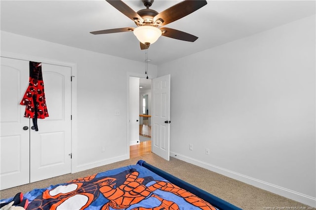 bedroom with ceiling fan and a closet