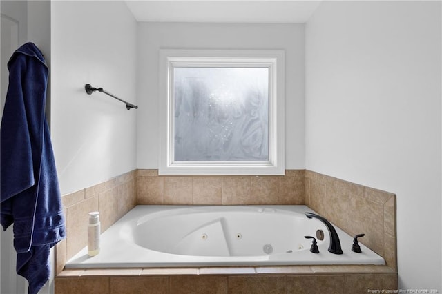 bathroom featuring a relaxing tiled tub