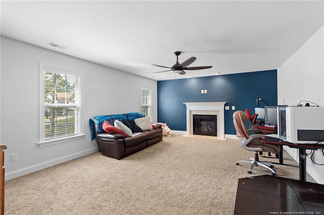 living room featuring carpet flooring and ceiling fan