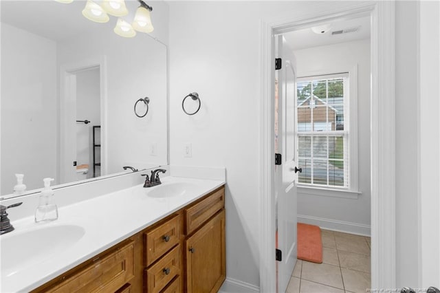 bathroom featuring tile patterned flooring and vanity