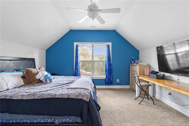 carpeted bedroom featuring lofted ceiling and ceiling fan