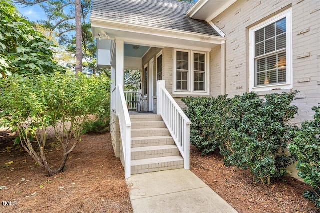 view of exterior entry featuring a porch