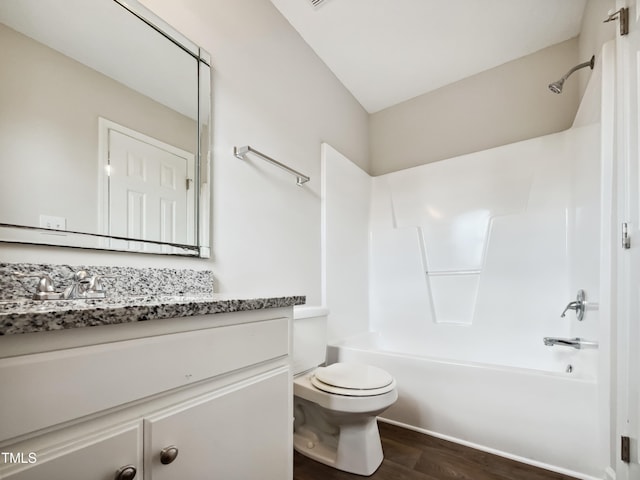 full bathroom featuring hardwood / wood-style flooring, vanity, toilet, and shower / bath combination