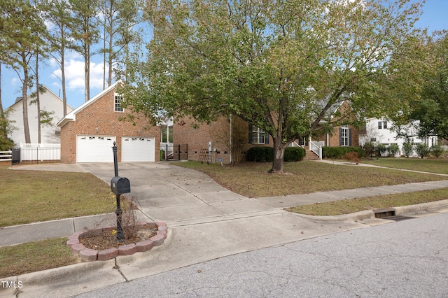 view of front facade with a garage and a front lawn