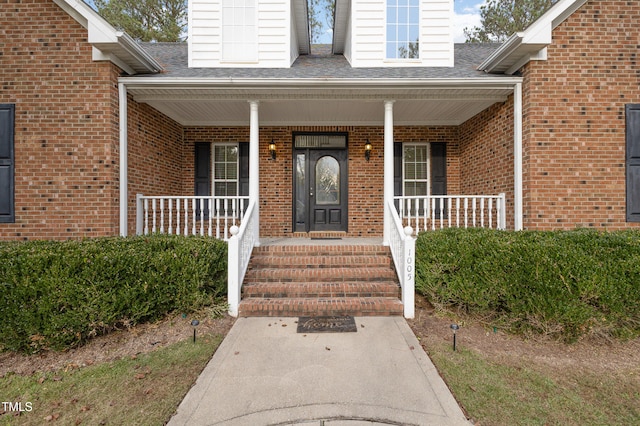 property entrance with covered porch