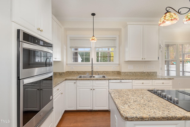 kitchen with white cabinets, sink, and double oven